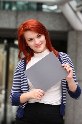 young-woman-holding-a-blank-card159022